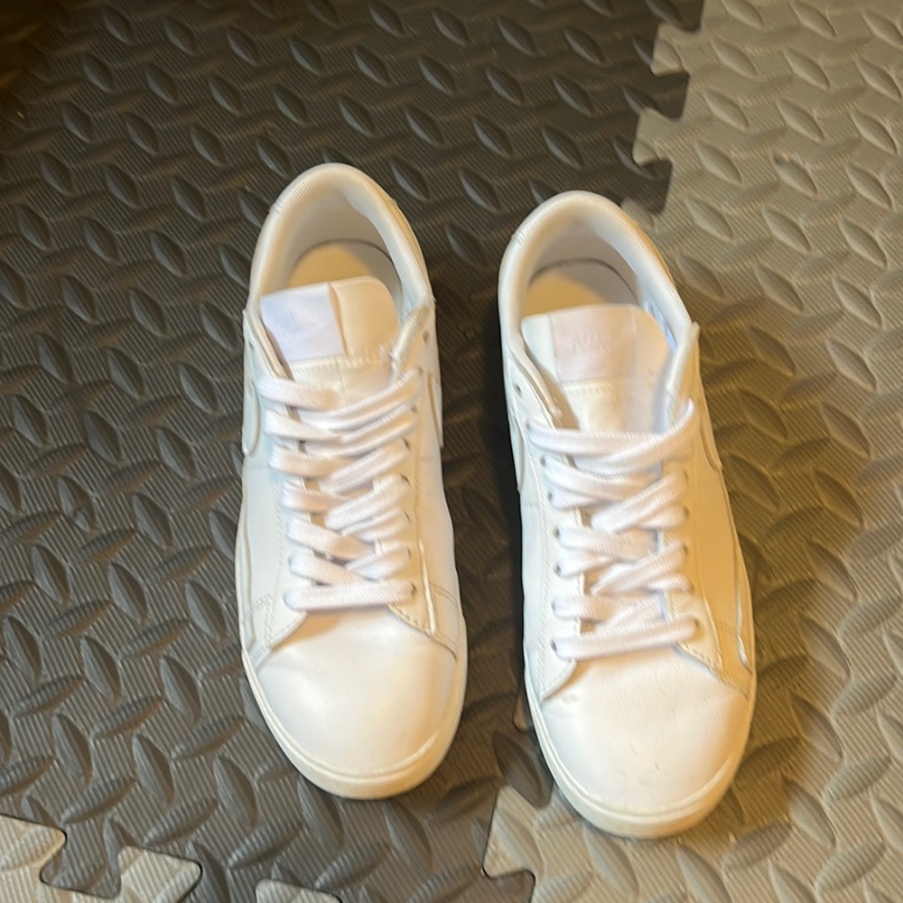 Women’s all white Nike shoes